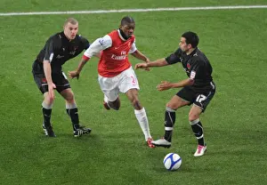 Abou Diaby (Arsenal) Stephen Dawson and Jason Crowe (Orient). Arsenal 5: 0 Leyton Orient