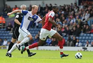 Images Dated 28th August 2010: Abou Diaby (Arsenal) Vince Grella (Blackburn). Blackburn Rovers 1: 2 Arsenal