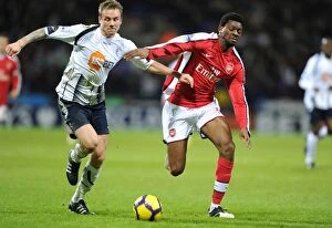 Bolton v Arsenal 2009-10 Collection: Abou Diaby and Matt Taylor Clash: Arsenal's Victory Over Bolton Wanderers (0:2)