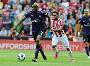 Images Dated 26th August 2012: Abou Diaby Outmaneuvers Jermaine Pennant: A Premier League Clash at Britannia Stadium, 2012