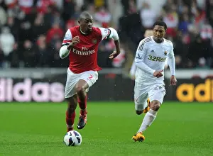 Swansea City V Arsenal 2012-13 Prints: Abou Diaby Outmaneuvers Jonathan de Guzman: A Premier League Battle at Swansea City
