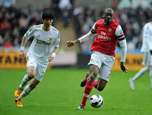 Swansea City V Arsenal 2012-13 Prints: Abou Diaby Outmaneuvers Ki Sung-Yueng: A Premier League Battle at Swansea, 2012-2013