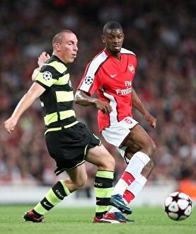 Arsenal V Celtic 2009-10 Prints: Abou Diaby and Scott Brown Clash in Intense Arsenal vs