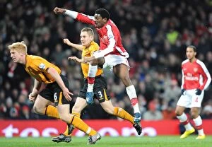Images Dated 19th December 2009: Abou Diaby shoots past Hull goalkeeper Boaz Myhill to score the 3rd Arsenal goal
