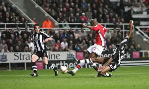 Abou Diaby shoots past Newcastle goalkeeper Steve Harper