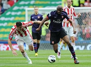 Stoke City v Arsenal 2012-13 Collection: Abou Diaby vs. Geoff Cameron: A Battle at Britannia Stadium - Stoke City vs. Arsenal (2012-13)