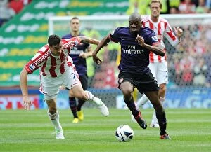Stoke City v Arsenal 2012-13 Collection: Abou Diaby vs. Geoff Cameron: Clash at Britannia Stadium (Stoke City vs. Arsenal, 2012-13)