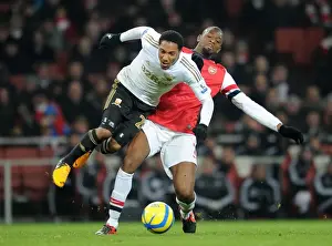 Arsenal V Swansea - FA Cup 3rd Rd Replay 2012-13 Prints: Abou Diaby vs. Jonathan De Guzman: Battle in the FA Cup Third Round Replay Between Arsenal and Swansea City