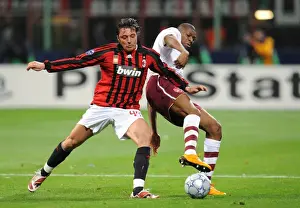 Abu Diaby and Massimo Oddo Clash in Intense Champions League Showdown: Arsenal's 2-0 Victory over AC Milan at San Siro Stadium (2008)