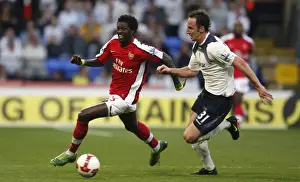 Bolton V Arsenal 2008-9 Prints: Adebayor vs. O'Brien: Intense Rivalry on the Soccer Field (Bolton vs)