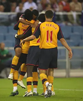 Adebayor's Double: Arsenal's Celebration after Scoring against FC Twente (Eboue, Walcott, van Persie)