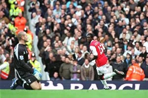 Arsenal v Tottenham 2006-07 Collection: Adebayor's Thrilling Goal: Arsenal Takes the Lead 1-0 Against Tottenham Hotspur (3:1 Final Score)