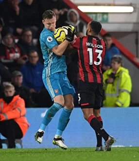 Images Dated 26th December 2019: AFC Bournemouth vs. Arsenal: Intense Clash Between Callum Wilson and Bernd Leno