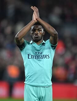 Images Dated 29th December 2018: Ainsley Maitland-Niles Applauds Arsenal Fans at Anfield After Liverpool Clash