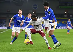 Brighton And Hove Albion V Arsenal 2020-21 Prints: Ainsley Maitland-Niles Clashes with Bernardo in Arsenal's Premier League Battle at Brighton & Hove Albion