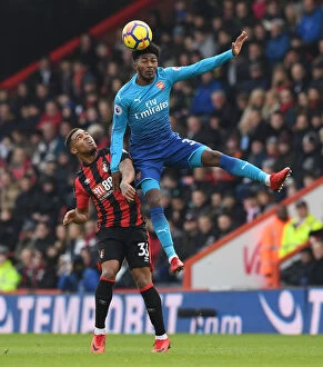 Images Dated 14th January 2018: Ainsley Maitland-Niles Leaps Over Jordan Ibe in AFC Bournemouth vs Arsenal Premier League Clash