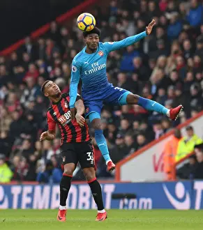 AFC Bournemouth V Arsenal 2017-18 Prints: Ainsley Maitland-Niles Leaps Over Jordan Ibe in AFC Bournemouth vs Arsenal Premier League Clash