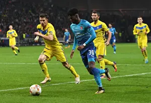 FC BATE Borisov V Arsenal 2017-18 Prints: Ainsley Maitland-Niles vs. Mirko Ivanic: Battle in the Europa League between Arsenal and BATE Borisov
