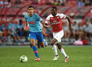 Arsenal V Atletico Madrid 2018-19 Prints: Ainsley Maitland-Niles vs Rodrigo: Clash of the Midfielders - Arsenal vs Atletico Madrid