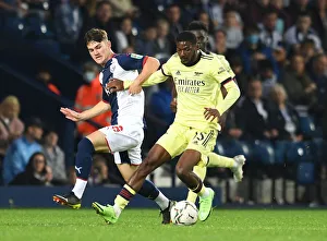 West Bromwich Albion V Arsenal - Carabao Cup 2021-22 Prints: Ainsley Maitland-Niles vs. Toby King: Arsenal's Battle with West Bromwich Albion in Carabao Cup Clash