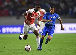 Al-Nasr Dubai SC V Arsenal 2018-19 Prints: Al-Nasr Dubai SC vs. Arsenal: Ainsley Maitland-Niles Faces Off Against Ali Hussain