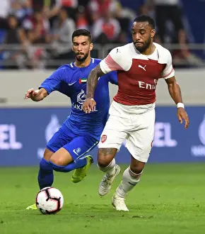 Al-Nasr Dubai SC V Arsenal 2018-19 Prints: Al-Nasr Dubai SC vs. Arsenal: Lacazette and Khamis Clash in Friendly Match