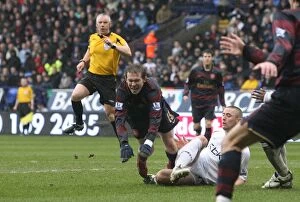 Images Dated 31st March 2008: Alex Hleb is tripped by Bolton defender Gary Cahill for the Arsenal penalty