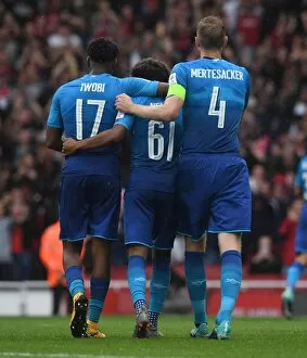 Alex Iwobi and Per Mertesacker congratulate Reiss Nelson on his assist. Arsenal 5