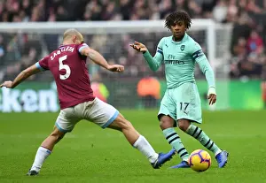 West Ham United V Arsenal 2018-19 Prints: Alex Iwobi Outsmarts Pablo Zabaleta: Arsenal's Skillful Midfielder Beats West Ham Defender