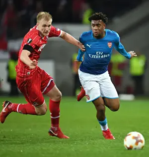 FC Koln V Arsenal 2017-18 Prints: Alex Iwobi's Thrilling Dash Past Frederik Sorensen: A Memorable Moment in Arsenal's Europa League Victory