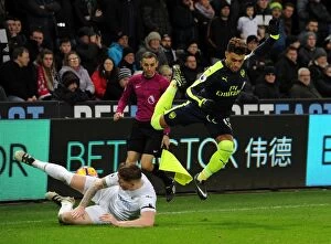Images Dated 14th January 2017: Alex Oxlade-Chamberlain (Arsenal) Alfie Mawson (Swansea). Swansea City 0: 4 Arsenal