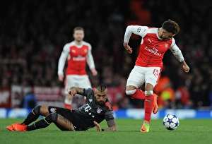 Images Dated 7th March 2017: Alex Oxlade-Chamberlain (Arsenal) Arturo Vidal (Bayern). Arsenal 1: 5 Bayern Munich