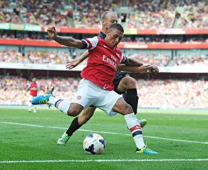 Arsenal v Galatasaray 2013-14 Gallery: Alex Oxlade-Chamberlain (Arsenal) Semih Kaya (Galatasaray). Arsenal 1: 2 Galatasaray