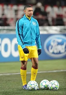 AC Milan V Arsenal 2011-12 Prints: Alex Oxlade-Chamberlain: Arsenal's Ready-to-Rise Star in AC Milan Showdown