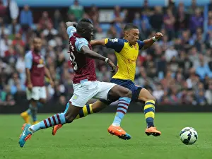 Aston Villa V Arsenal 2014-15 Prints: Alex Oxlade-Chamberlain Outmaneuvers Aly Cissokho in Aston Villa vs Arsenal Premier League Clash