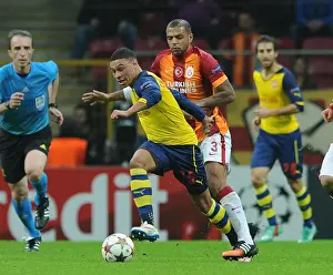 Galatasaray V Arsenal 2014/15 Prints: Alex Oxlade-Chamberlain Outmaneuvers Felipe Melo in Galatasaray vs Arsenal UCL Clash