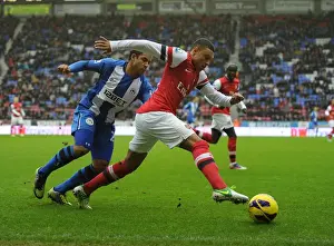Wigan Athletic V Arsenal 2012-13 Prints: Alex Oxlade-Chamberlain Outmaneuvers Jean Beausejour: Wigan Athletic vs Arsenal