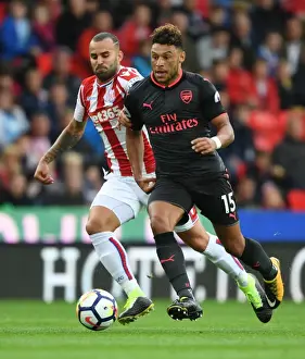 Stoke City V Arsenal 2017-18 Prints: Alex Oxlade-Chamberlain Outsmarts Jese: A Premier League Battle at Stoke City, 2017-18