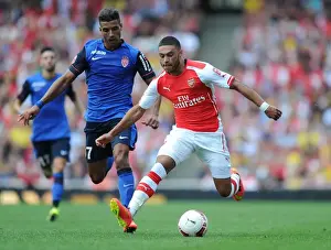 Arsenal V AS Monaco 2014-15 Prints: Alex Oxlade-Chamberlain Outsmarts Nabil Dirar: Arsenal vs AS Monaco