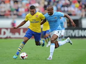 Arsenal V Manchester City Pre Season 2013-14 Prints: Alex Oxlade-Chamberlain Outsmarts Vincent Kompany: A Masterful Dodge at Arsenal vs