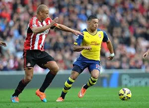Sunderland v Arsenal 2014/15 Collection: Alex Oxlade-Chamberlain Outsmarts Wes Brown: Arsenal's Masterful Midfield Play vs Sunderland, 2014