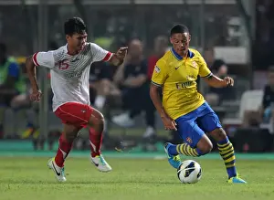 Indonesia Dream Team V Arsenal 2013-14 Prints: Alex Oxlade-Chamberlain vs. Ahmad Jufrianto: Arsenal vs. Indonesia All-Stars, 2013