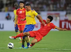 Vietnam V Arsenal 2013-14 Prints: Alex Oxlade-Chamberlain vs Pham Nguyen Sa: Vietnam vs Arsenal Clash, 2013