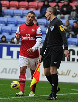 Wigan Athletic V Arsenal 2012-13 Prints: Alex Oxlade-Chamberlain's Humorous Interlude