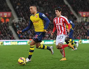 Alex Oxlade-Chamberlain's Sneaky Move: Outsmarting Bojan in the Stoke City vs. Arsenal Clash (2014-15)