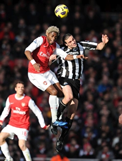 Arsenal v Newcastle United 2010-11 Collection: Alex Song (Arsenal) Andy Carroll (Newcastle). Arsenal 0: 1 Newcastle United