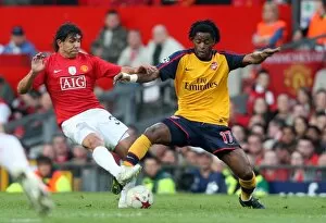 Manchester United v Arsenal 2008-09 Champions League 1-2 1st Leg Collection: Alex Song (Arsenal) Carlos Tevez (Man Utd)