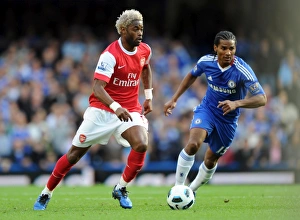 Chelsea v Arsenal 2010-11 Collection: Alex Song (Arsenal) Florent Malouda (Chelsea). Chelsea 2: 0 Arsenal, Barclays Premier League