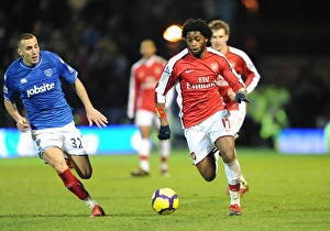Portsmouth v Arsenal 2009-10 Collection: Alex Song (Arsenal) Hassan Yebda (Portsmouth). Portsmouth 1: 4 Arsenal, Barclays Premier League