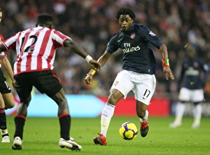 Images Dated 21st November 2009: Alex Song (Arsenal) John Mensah (Sunderland). Sunderland 1: 0 Arsenal, Barclays Premier League
